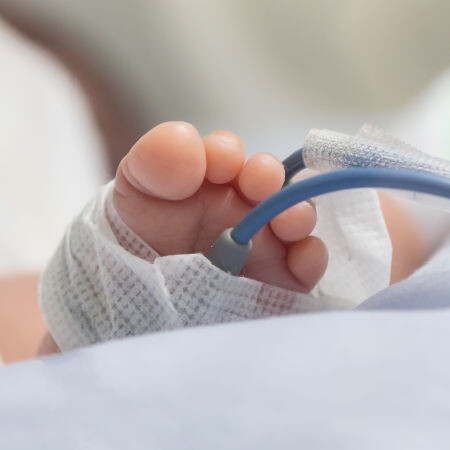 foot of a baby with hospital monitoring equipment attached