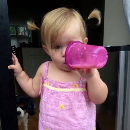 baby drinking out of a sippy cup