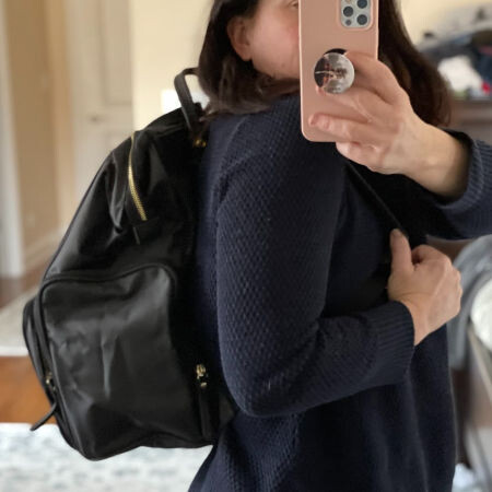 woman wearing breast pump backpack