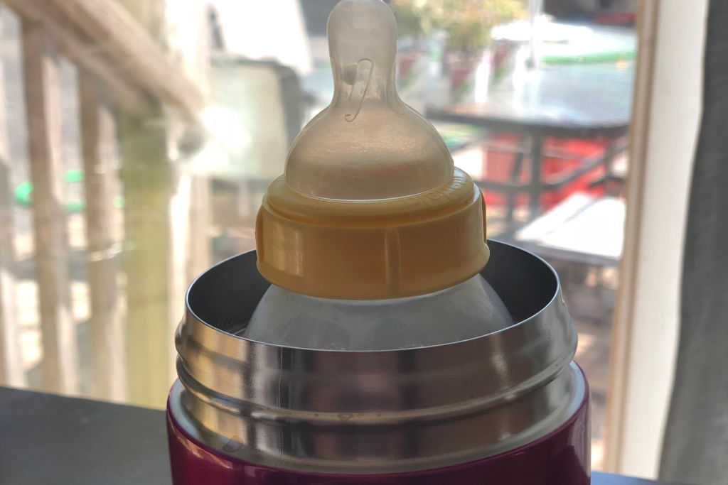 bottle of Medela breast milk in a thermos