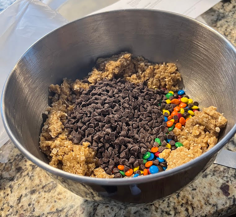 chocolate chips and M&Ms added to cookie dough