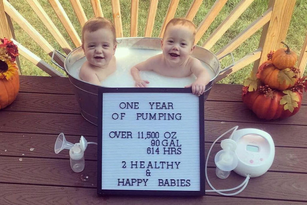 babies in a milk bath with a letterboard stating one year of pumping