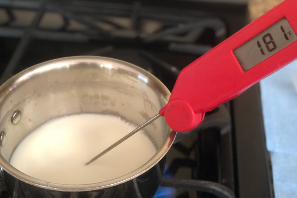 woman scalding breast milk by heating it to 180 degreess