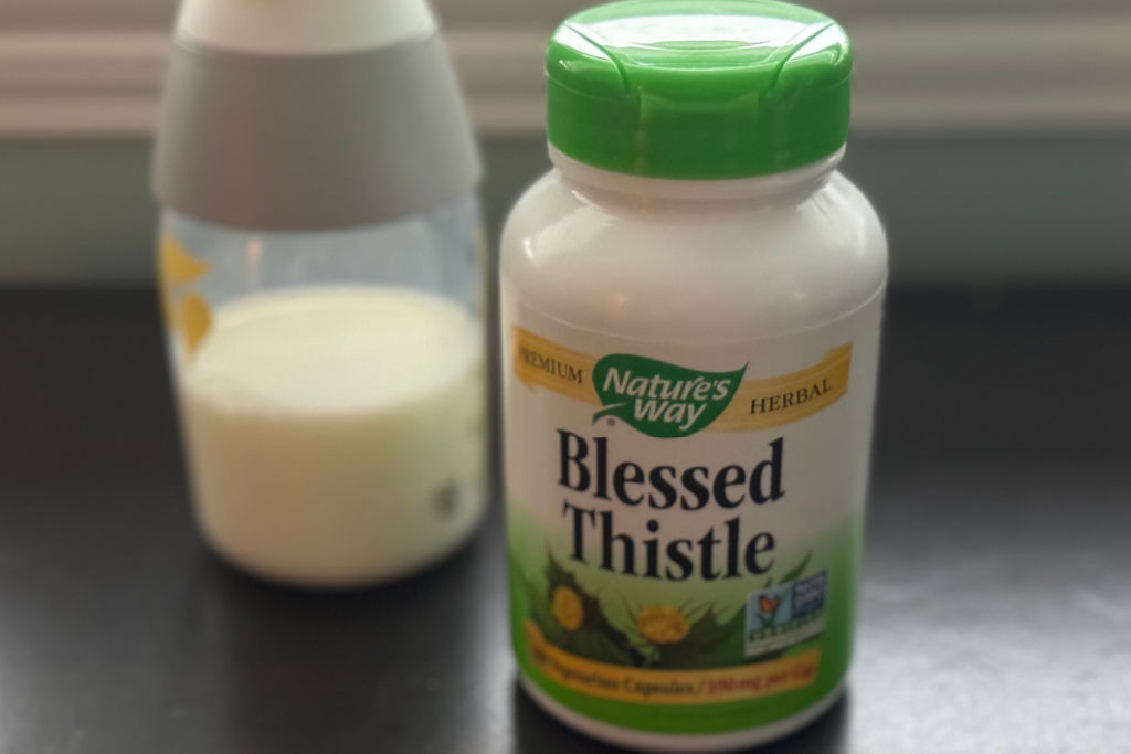 blessed thistle and bottle of breast milk