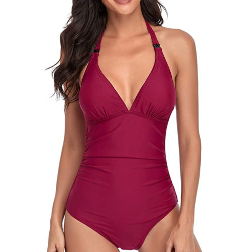 Woman wearing red nursing swimsuit with a white background