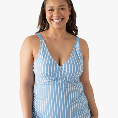 Woman wearing a blue and white hands-free pumping tankini nursing swimsuit on a white background