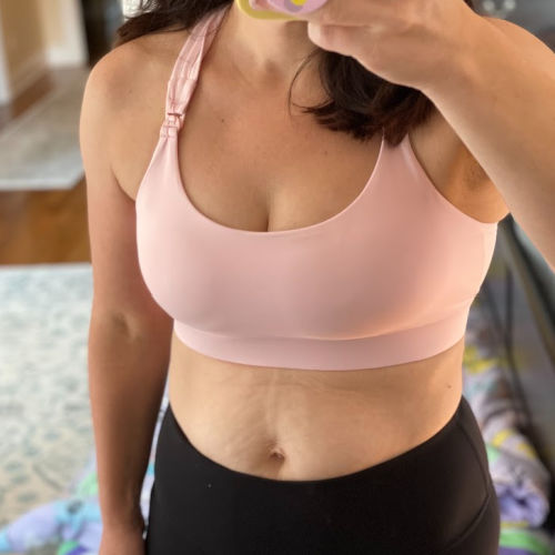 woman wearing pink Sweat and Milk Chloe nursing sports bra